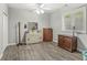 Bright bedroom featuring gray walls, light wood floors, and large windows for natural light at 7421 Meadow Violet Ct, Avon, IN 46123