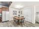 Basement dining area with wood table, chairs, and a convenient refrigerator at 7421 Meadow Violet Ct, Avon, IN 46123