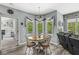 Bright dining area with round table, backyard views, and hardwood-style flooring at 7421 Meadow Violet Ct, Avon, IN 46123
