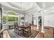 Dining room with large window and hardwood floors at 7421 Meadow Violet Ct, Avon, IN 46123
