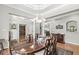 Elegant dining area featuring hardwood floors and decorative lighting at 7421 Meadow Violet Ct, Avon, IN 46123