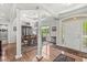 Formal dining area featuring elegant columns and hardwood floors at 7421 Meadow Violet Ct, Avon, IN 46123