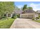 Charming brick home with a well-manicured lawn and three-car garage at 7421 Meadow Violet Ct, Avon, IN 46123