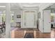 Bright foyer with hardwood floors and elegant front door at 7421 Meadow Violet Ct, Avon, IN 46123
