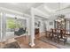 Elegant living space with hardwood floors, large windows, and a formal dining area at 7421 Meadow Violet Ct, Avon, IN 46123