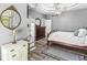 Stylish main bedroom boasting hard wood floors, natural light, ceiling fan, and neutral paint at 7421 Meadow Violet Ct, Avon, IN 46123
