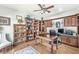Well-appointed office featuring custom wood bookshelves and a spacious desk at 7421 Meadow Violet Ct, Avon, IN 46123
