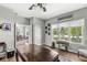Bright office space with large windows, hardwood floors, and an antique sewing machine table at 7421 Meadow Violet Ct, Avon, IN 46123
