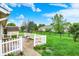 Large backyard featuring a white picket fence, grassy areas, and a shed, creating a perfect outdoor space at 7840 Park Ward Pl, Indianapolis, IN 46259
