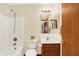 Bathroom featuring vanity, sink, mirror, and shower-tub combo at 7840 Park Ward Pl, Indianapolis, IN 46259