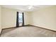 Bright bedroom with carpet, window, and neutral paint at 7840 Park Ward Pl, Indianapolis, IN 46259