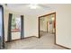 Bright bedroom with neutral walls, carpet flooring, and a closet at 7840 Park Ward Pl, Indianapolis, IN 46259