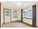 Cozy bedroom with natural light, featuring gray curtains, and a ceiling fan at 7840 Park Ward Pl, Indianapolis, IN 46259