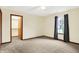 Carpeted bedroom with closet and window with blinds at 7840 Park Ward Pl, Indianapolis, IN 46259