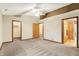 Large bedroom with vaulted ceiling and view to bathroom and closet at 7840 Park Ward Pl, Indianapolis, IN 46259