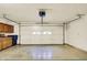 Spacious two-car garage featuring a modern overhead door, ample storage, and a clean, well-maintained floor at 7840 Park Ward Pl, Indianapolis, IN 46259
