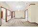 Open living space featuring neutral carpeting and multiple entryways, offering great flow and connectivity at 7840 Park Ward Pl, Indianapolis, IN 46259
