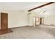 Open-concept living space with vaulted ceiling, modern lighting, and neutral carpeting, ready for personalization at 7840 Park Ward Pl, Indianapolis, IN 46259
