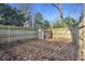Fenced backyard featuring a storage shed at 7910 Teel Way, Indianapolis, IN 46256
