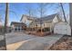 Spacious backyard with concrete patio, wood deck, and storage shed at 7910 Teel Way, Indianapolis, IN 46256
