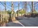 Backyard area with a stone fire pit and a wooden fence surround at 7910 Teel Way, Indianapolis, IN 46256