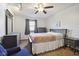 Bedroom featuring a bed and matching dresser with a ceiling fan, offering a comfortable retreat at 7910 Teel Way, Indianapolis, IN 46256
