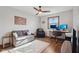 Cozy bedroom with a daybed, ceiling fan, desk, and natural light from the window at 7910 Teel Way, Indianapolis, IN 46256