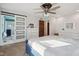 Bedroom featuring a bed with a sliding door to bathroom, offering comfort and convenience at 7910 Teel Way, Indianapolis, IN 46256