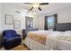 Bedroom featuring a bed and dresser with a ceiling fan, creating a tranquil and inviting atmosphere at 7910 Teel Way, Indianapolis, IN 46256