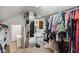 Spacious walk-in closet featuring shelving, a hanging rack, and mirrored storage at 7910 Teel Way, Indianapolis, IN 46256