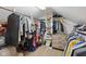 Organized walk-in closet with clothing racks, shelving, and a three-drawer dresser at 7910 Teel Way, Indianapolis, IN 46256