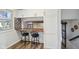 Open kitchen layout with breakfast bar, butcher block countertop, white cabinets, and stainless steel appliances at 7910 Teel Way, Indianapolis, IN 46256