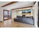Spacious living room with tile floors, exposed wooden beams, and a stone fireplace with mounted televisions at 7910 Teel Way, Indianapolis, IN 46256