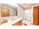 Bright bathroom features a shower and a wood vanity with countertop and sink at 7937 Bentley Commons Dr, Indianapolis, IN 46259