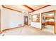 Open dining area with decorative wood beams and a view to the kitchen at 7937 Bentley Commons Dr, Indianapolis, IN 46259