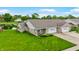 Charming townhome with well-maintained landscaping, attached garage, and lovely pond views at 7937 Bentley Commons Dr, Indianapolis, IN 46259