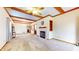 Bright living room with fireplace, decorative wood beams, and open layout at 7937 Bentley Commons Dr, Indianapolis, IN 46259