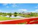 Scenic community pond surrounded by lush greenery and mature trees at 7937 Bentley Commons Dr, Indianapolis, IN 46259