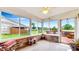 Enclosed porch with views of the backyard, offering a serene space for relaxation and enjoying the outdoors at 7937 Bentley Commons Dr, Indianapolis, IN 46259