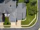 Aerial view of the home's roof, driveway, and surrounding yard space featuring mature trees at 8133 Hazen Way, Indianapolis, IN 46216