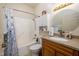 Functional bathroom with a shower-tub, a single sink vanity, and a cabinet for storage at 8133 Hazen Way, Indianapolis, IN 46216