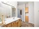 Practical bathroom includes vanity with storage, a shower-tub combo, and laundry hookups for convenience at 8133 Hazen Way, Indianapolis, IN 46216