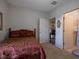 Cozy bedroom features a comfortable bed, neutral walls, and an ensuite bathroom for added convenience at 8133 Hazen Way, Indianapolis, IN 46216