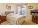Bright bedroom offering natural light, a comfy bed, and soft carpet flooring for a relaxing ambiance at 8133 Hazen Way, Indianapolis, IN 46216