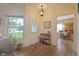 Inviting foyer with hardwood floors and views into the dining area at 8133 Hazen Way, Indianapolis, IN 46216