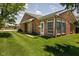 Beautiful home featuring a well-maintained lawn and charming exterior details at 8133 Hazen Way, Indianapolis, IN 46216