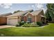 Well-maintained brick home with green lawn and mature landscaping at 8133 Hazen Way, Indianapolis, IN 46216