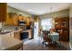 Well-lit kitchen featuring wood cabinets, stainless steel appliances, and an eat-in area at 8133 Hazen Way, Indianapolis, IN 46216