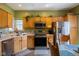 Bright kitchen featuring stainless steel appliances, wooden cabinets, and modern design at 8133 Hazen Way, Indianapolis, IN 46216