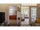 View of living spaces leading to a sunroom and bedroom, offering an open floor plan at 8133 Hazen Way, Indianapolis, IN 46216